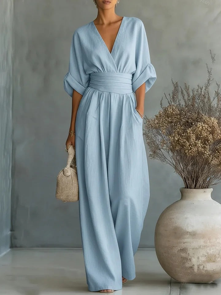 Elegant jumpsuit for damer med vide bukseben, V-utringning og flytende snitt