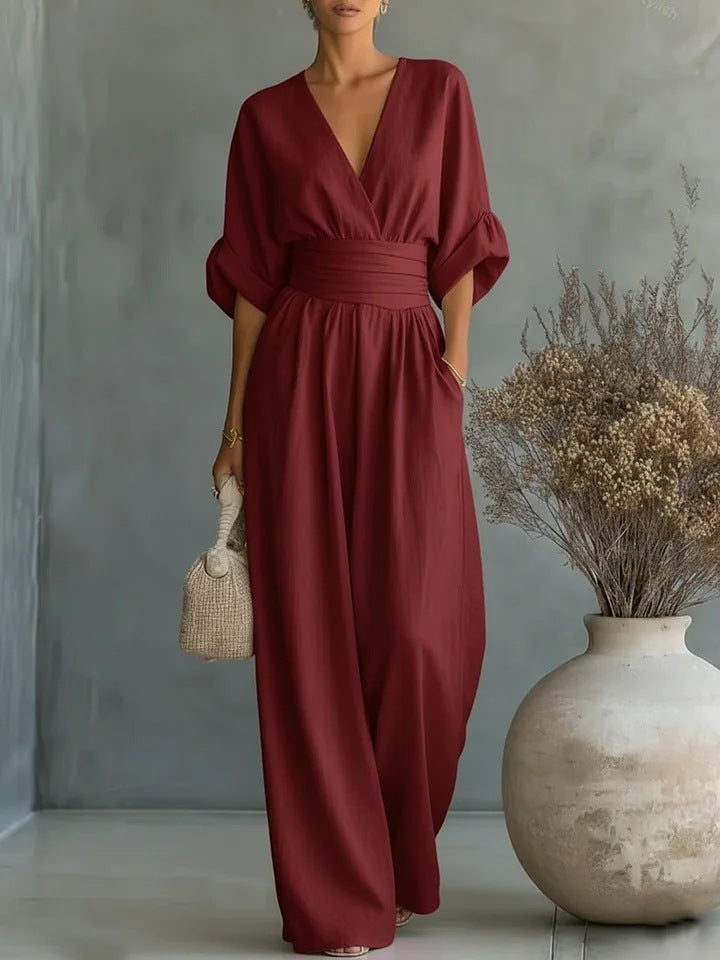 Elegant jumpsuit for damer med vide bukseben, V-utringning og flytende snitt