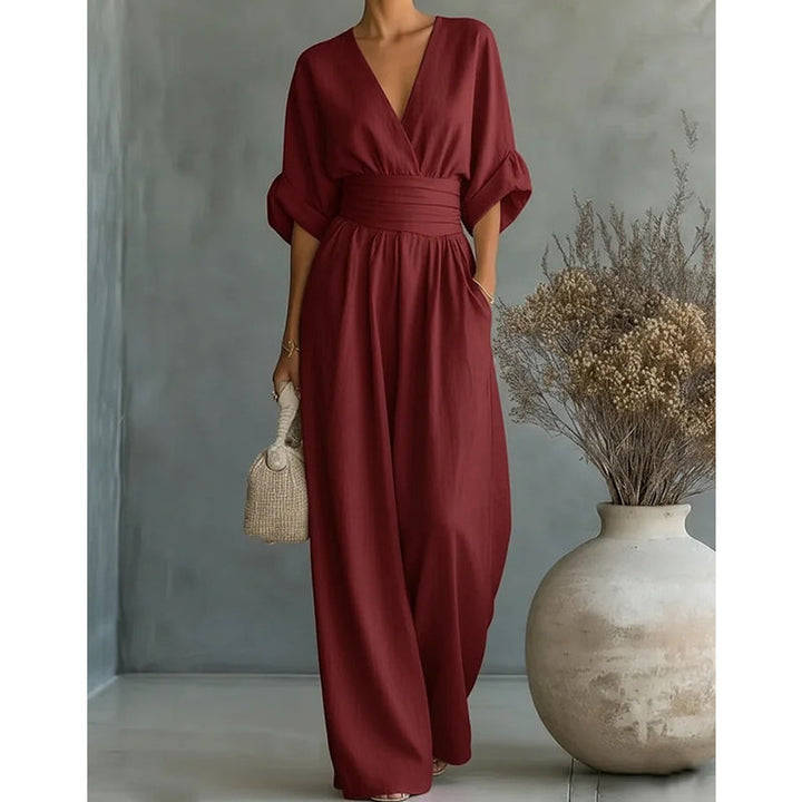 Elegant jumpsuit for damer med vide bukseben, V-utringning og flytende snitt