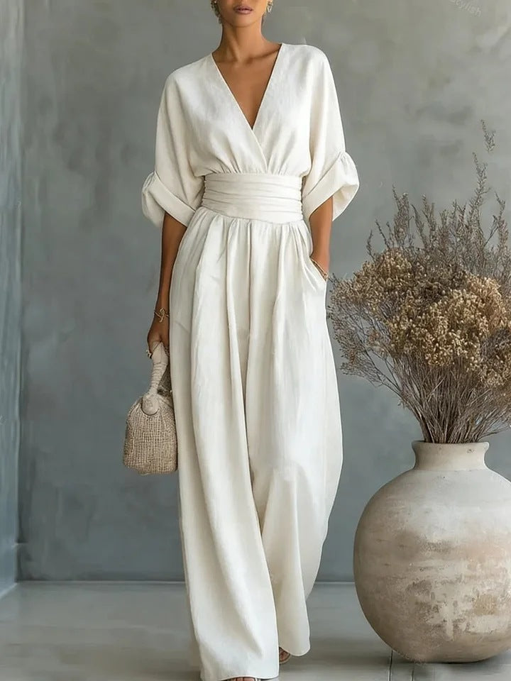 Elegant jumpsuit for damer med vide bukseben, V-utringning og flytende snitt