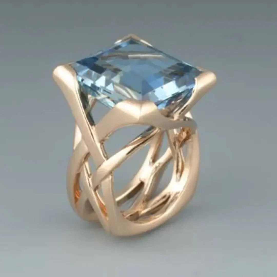 Elegant ring i roségull med blå zirkonia