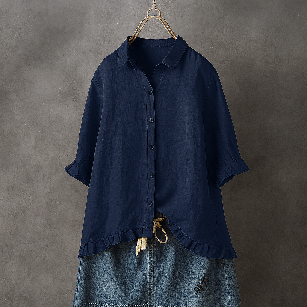 Blouse in cotton with buttons and ruffles on the edge