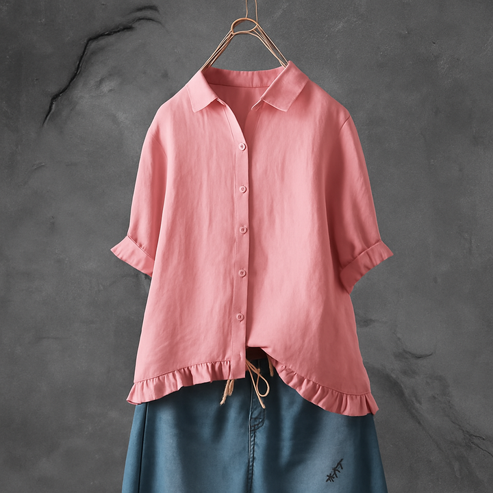 Blouse in cotton with buttons and ruffles on the edge