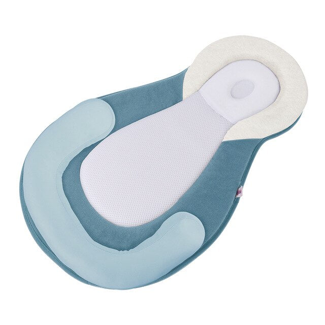Ergonomisk bærbar babyseng med hodestøtte mot flatt hode – Schlafcocon