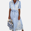 Embroidered blue dress with elegant details