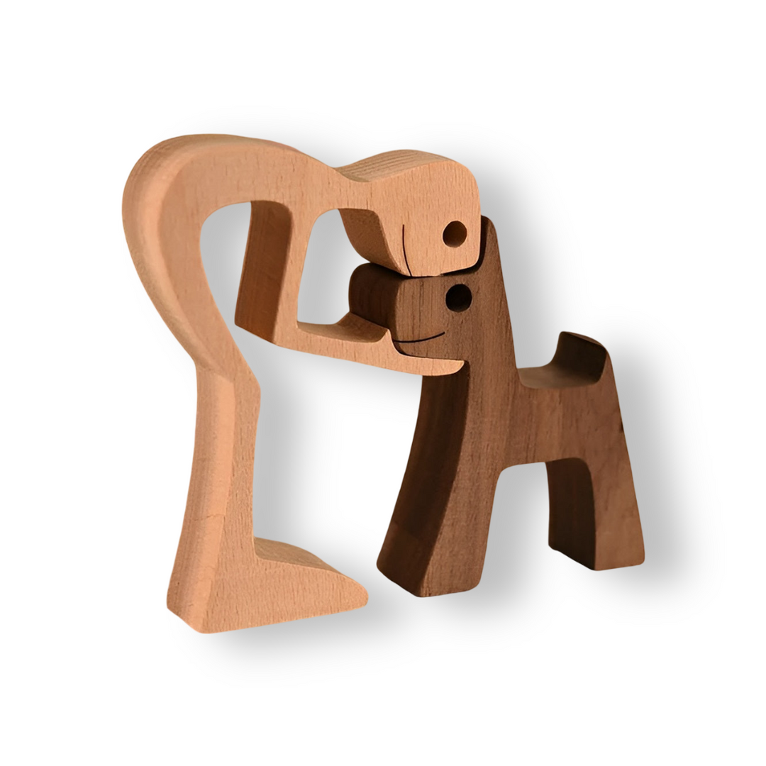Treskulptur av menneske og hund, håndlaget