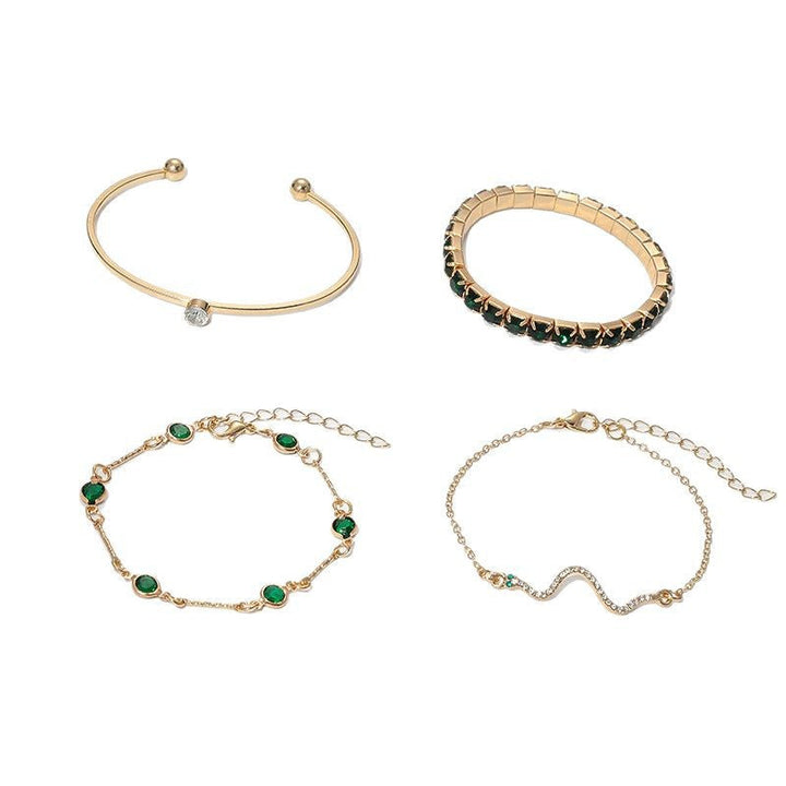 Elegant armbåndsett i gull med raffinerte detaljer