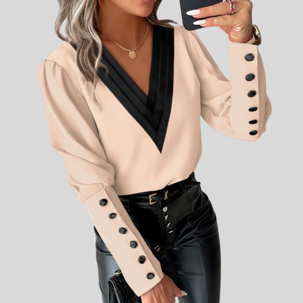 Damebluse med knapper og puffede ermer – Statement-erme med uformell eleganse