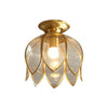 Taklampe i messing med klart glass