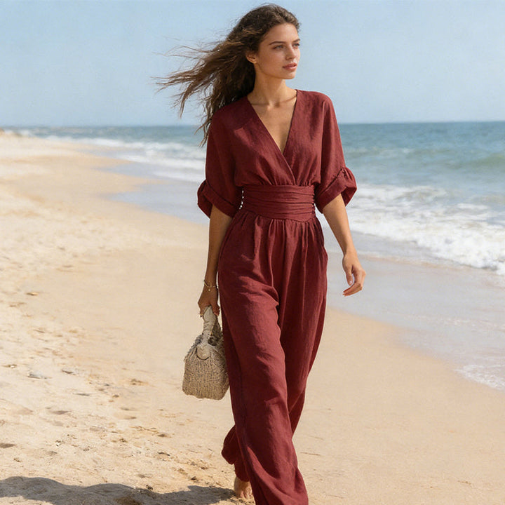 Elegant jumpsuit for damer med vide bukseben, V-utringning og flytende snitt