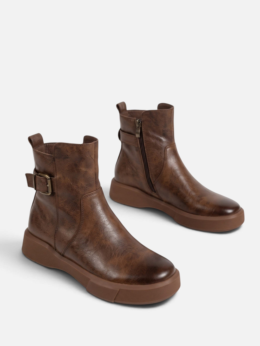 Ankelstøvletter i skinn med spenne og tykk såle