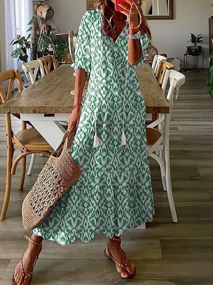 Bohemian Maxi Dress with Off-Shoulder Design and Voluminous Sleeves